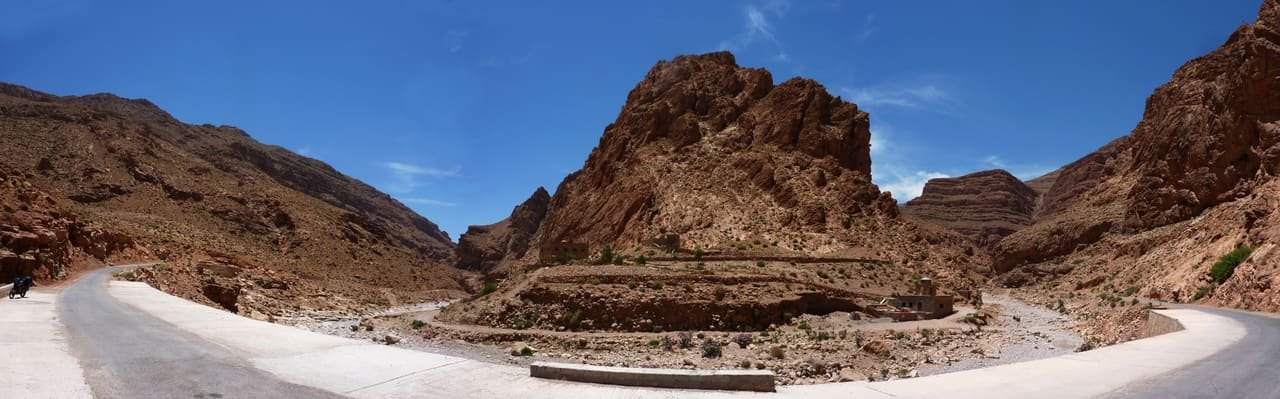 The sheer limestone walls of the Todra gorge under midday sun